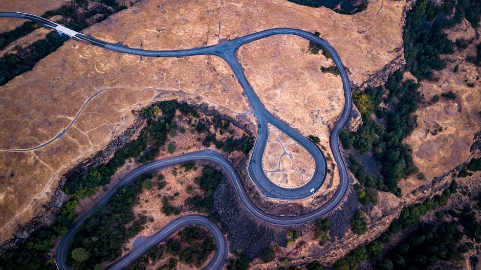Stunning aerial view of a winding road in Mosier, Oregon, showcasing the landscape's natural beauty.